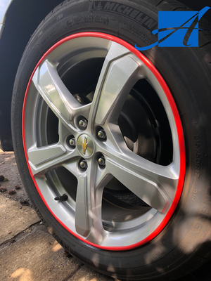 Red rim protector wheel guards on the edge of a Chevy Volt wheel for ATAM Auto.